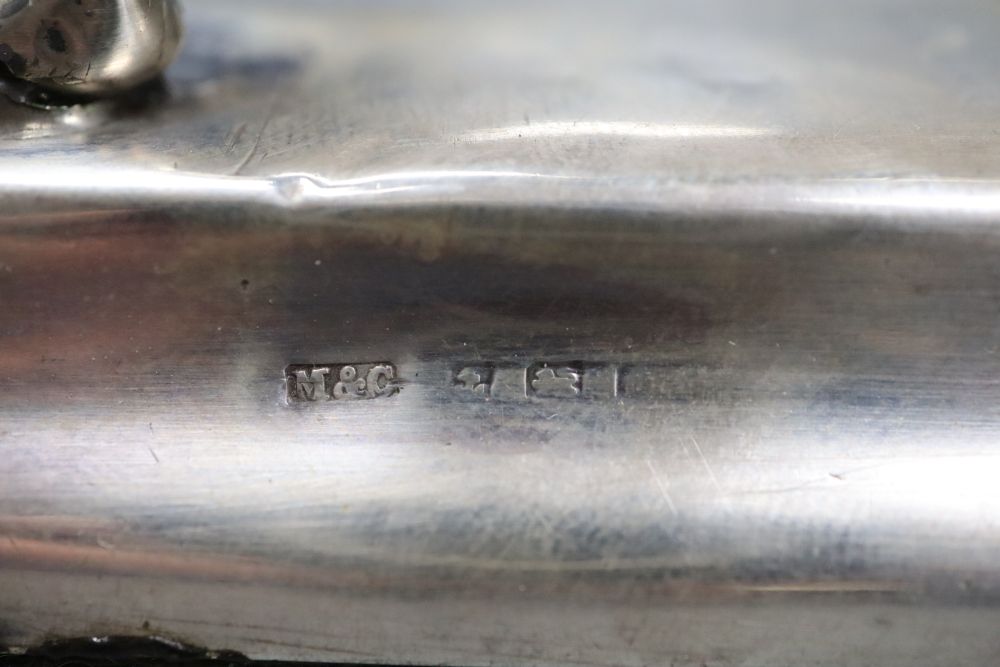An early 20th century novelty silver mounted timepiece, modelled as the Lincoln Imp(a.f.), height 12.4cm, weighted.